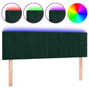 sengegavl med LED-lys 144x5x78/88 cm fløjl mørkegrøn