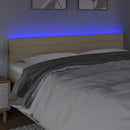 sengegavl med LED-lys 160x5x78/88 cm stof cremefarvet