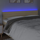 sengegavl med LED-lys 180x5x78/88 cm stof cremefarvet