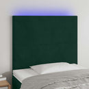 sengegavl med LED-lys 100x5x118/128 cm fløjl mørkegrøn