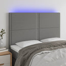 sengegavl med LED-lys 144x5x118/128 cm stof mørkegrå