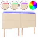 sengegavl med LED-lys 180x5x118/128 cm stof cremefarvet
