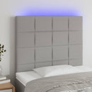 sengegavl med LED-lys 100x5x118/128 cm stof lysegrå