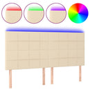 sengegavl med LED-lys 160x5x118/128 cm stof cremefarvet