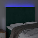 sengegavl med LED-lys 144x5x118/128 cm fløjl mørkegrøn