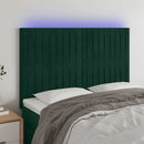 sengegavl med LED-lys 144x5x118/128 cm fløjl mørkegrøn