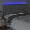 sengegavl med LED-lys 180x7x118/128 cm stof lysegrå