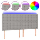 sengegavl med LED-lys 180x5x118/128 cm stof lysegrå