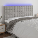sengegavl med LED-lys 200x5x118/128 cm stof lysegrå