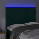 sengegavl med LED-lys 144x5x118/128 cm fløjl mørkegrøn