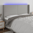 sengegavl med LED-lys 203x16x118/128 cm stof lysegrå