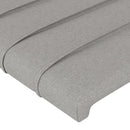 sengegavl med LED-lys 83x16x118/128 cm stof lysegrå