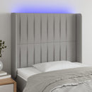 sengegavl med LED-lys 83x16x118/128 cm stof lysegrå