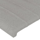 sengegavl med LED-lys 93x16x118/128 cm stof lysegrå