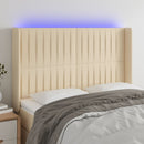 sengegavl med LED-lys 147x16x118/128 cm stof cremefarvet