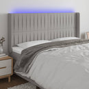 sengegavl med LED-lys 163x16x118/128 cm stof lysegrå