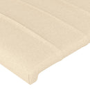 sengegavl med LED-lys 163x16x118/128 cm stof cremefarvet