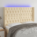 sengegavl med LED-lys 147x16x118/128 cm stof cremefarvet