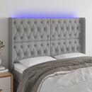 sengegavl med LED-lys 163x16x118/128 cm stof lysegrå
