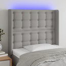 sengegavl med LED-lys 83x16x118/128 cm stof lysegrå