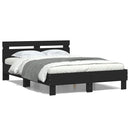 sengeramme med sengegavl og LED-lys 120x190 cm sort