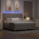 Box spring seng med LED-lysstrimler Gråbrun 180 x 200 cm Stof